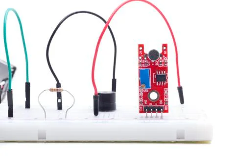 Red sound sensor in breadboard Stock Photos