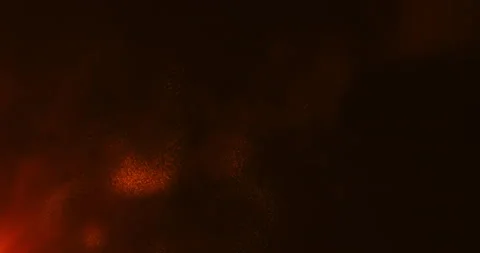 Red sparks blown away by the wind and smoke from a fire Stock Footage 239714465