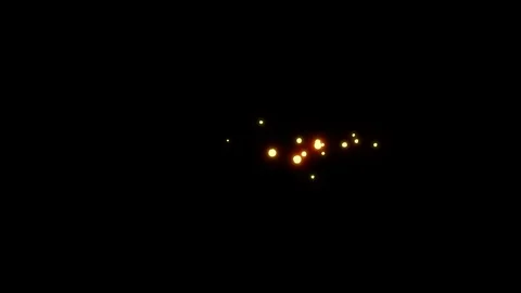 Red sparks leftward motion with dark background Stock Footage 123900641