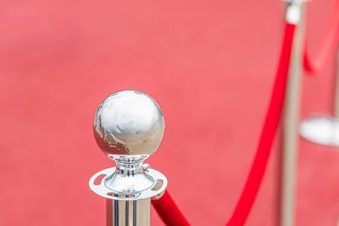 Red sphere on stand in red setting, reflective surface, diffuse artificial li Stock Photos