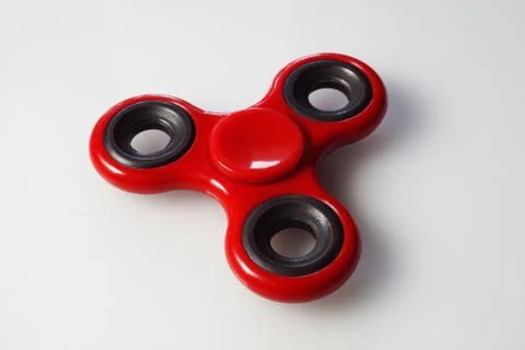 Red spiner is on the table Stock Photos