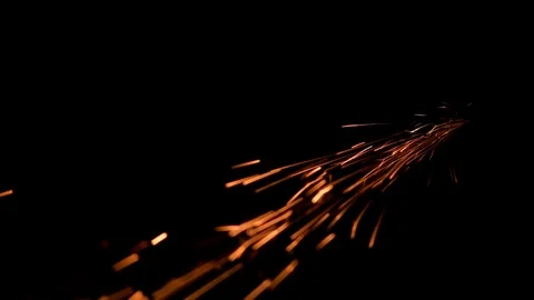 Red splashes of fire particles in the dark Falling down Stock Footage 98491434