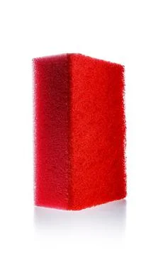 Red sponge, kitchen cleaner with abrasive surface for dish washing Fotos de archivo