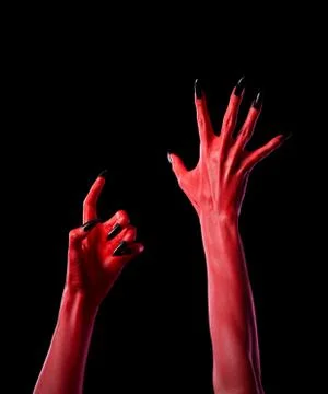 Red spooky devil hands with black nails, real body-art 스톡 사진