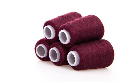 Red spool of thread isolated on white background. Skein of woolen threads. Yarn Stock Photos