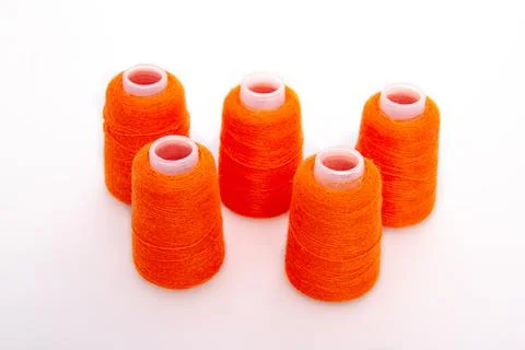 Red spool of thread isolated on white background. Skein of woolen threads. Yarn Stock Photos