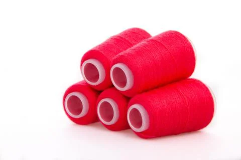 Red spool of thread isolated on white background. Skein of woolen threads. Yarn Stock Photos