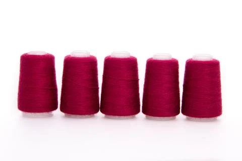 Red spool of thread isolated on white background. Skein of woolen threads. Yarn Stock Photos