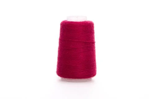 Red spool of thread isolated on white background. Skein of woolen threads. Yarn Stock Photos