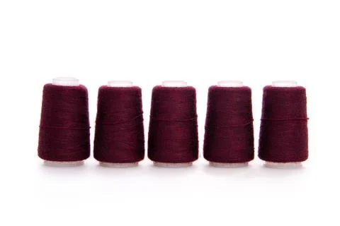 Red spool of thread isolated on white background. Skein of woolen threads. Yarn Stock Photos