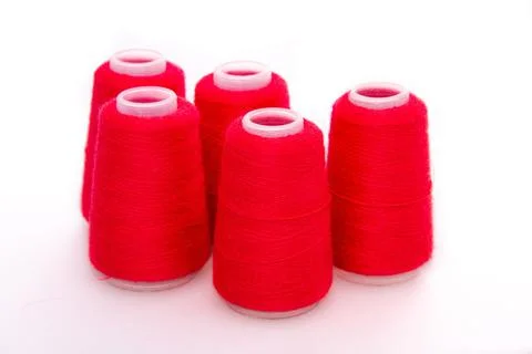 Red spool of thread isolated on white background. Skein of woolen threads. Yarn Stock Photos