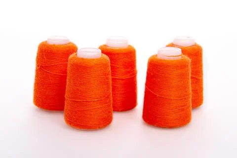Red spool of thread isolated on white background. Skein of woolen threads. Yarn Stock Photos