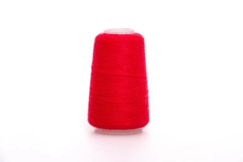 Red spool of thread isolated on white background. Skein of woolen threads. Yarn Stock Photos