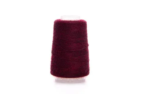 Red spool of thread isolated on white background. Skein of woolen threads. Yarn Stock Photos