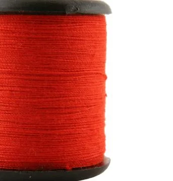 Red spool of thread Foto stock