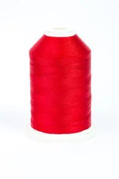 Red spool of thread on white background Stock Photos