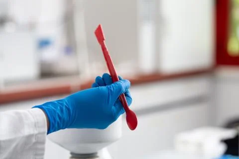 Red spoon for lab tests 스톡 사진