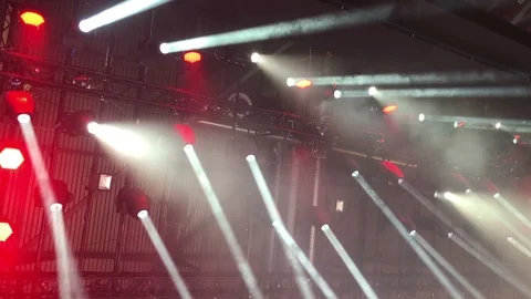 Red spotlight light performance of the truss light structure camera footage Stock Footage 86978170