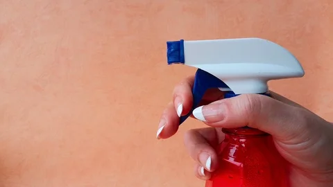 Red spray bottle with a white nozzle Stock Footage 103857500