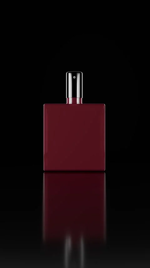 Red Square Bottle With Silver Cap Against Black Reflective Background Stock Footage 316681050