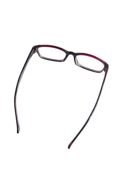 Red square eyeglass frames in the photo from the side isolated on a white bac Stock Photos