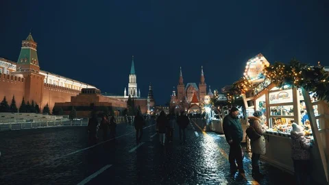 Red Square panorama Kremlin Clock Wall, people blured, xmas toys, fair Stock Footage 103055340
