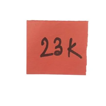 Red square sticky note with handwritten 23k text isolated on a transparent .. Stock Photos