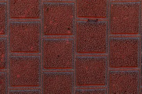 Red square stone background. Rough textures of some building material. Stock Photos