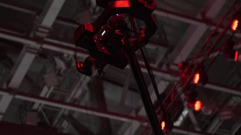 Red stage lighting rig and camera setup capturing dramatic concert atmosphere Stock Footage 336340080