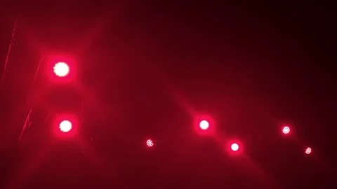 Red stage lights on dark background Stock Footage 337800604