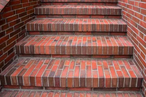 Red stairs made of bricks toward somewhere Stock Photos