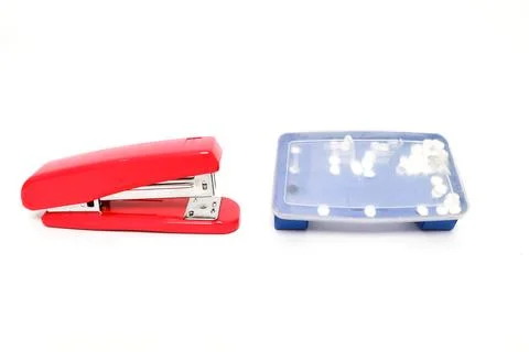 Red stapler and staple box on a white background in a studio shot for stati.. Stock Photos