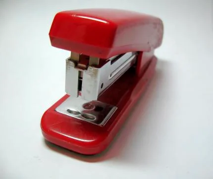 Red stapler isolated on the white background Stock Photos