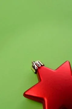 Red star shape on green Stock Photos