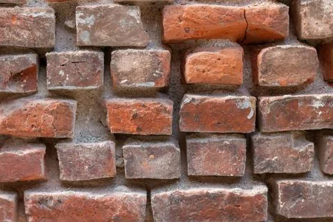 Red stone wall as a background or texture. Stock-Fotos