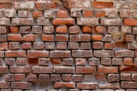 Red stone wall as a background or texture. Fotos de archivo