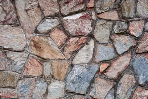 Red stone wall textured background Stock Photos