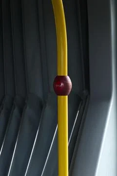 Red 'Stop' Button on Yellow Trolley Pole Stock Photos