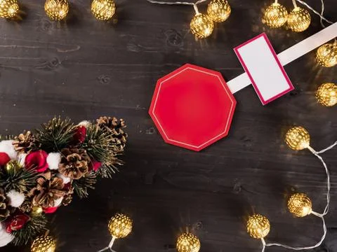 Red stop sign with gift wrap and holiday decorations Stock Photos