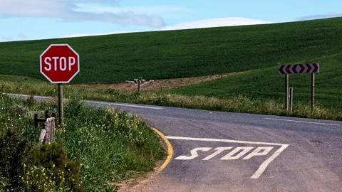 Red stop sign at an intersection in South Africa Stock Footage 343460190
