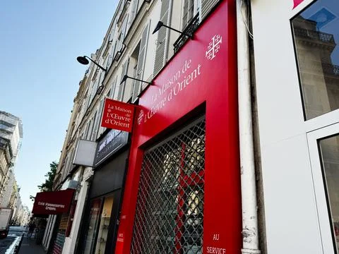 Red storefront of La Maison de l'Oeuvre d'Orient on a Paris, France street .. Stock Photos