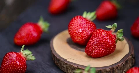Red strawberries on a cherry board, several red sweet strawberries in close-up Stock Footage 289382406