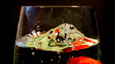 Red strawberries falling in cup in slow motion Stock Footage 145349859