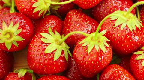 Red Strawberries Rotate. Stockbeeldmateriaal 64890634