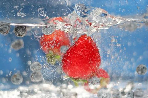 Red Strawberries Splash Stock Photos