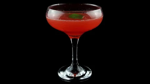 Red Strawberry cocktail with basil leaf on black background Stock Footage 75626729