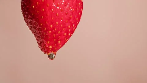 Red strawberry isolated on pink background, juicy ripe berry close-up, sweet Stock Footage 197373338