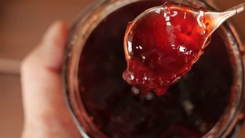 Red strawberry jam, raspberry in a jar Stock Footage 125161272