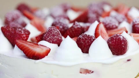 Red strawberry, raspberry in powdered sugar and whipped cream turn, close-up Stock Footage 276363948