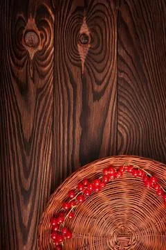 Red string lights on woven basket with wooden background Stock Photos